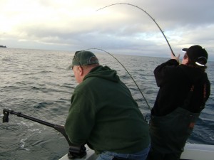 Boop reels in a king while Ron cranks the downrigger