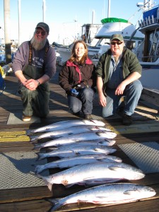 Capt. Pete, Erica, andf Capt. Ron with a limit of king salmon